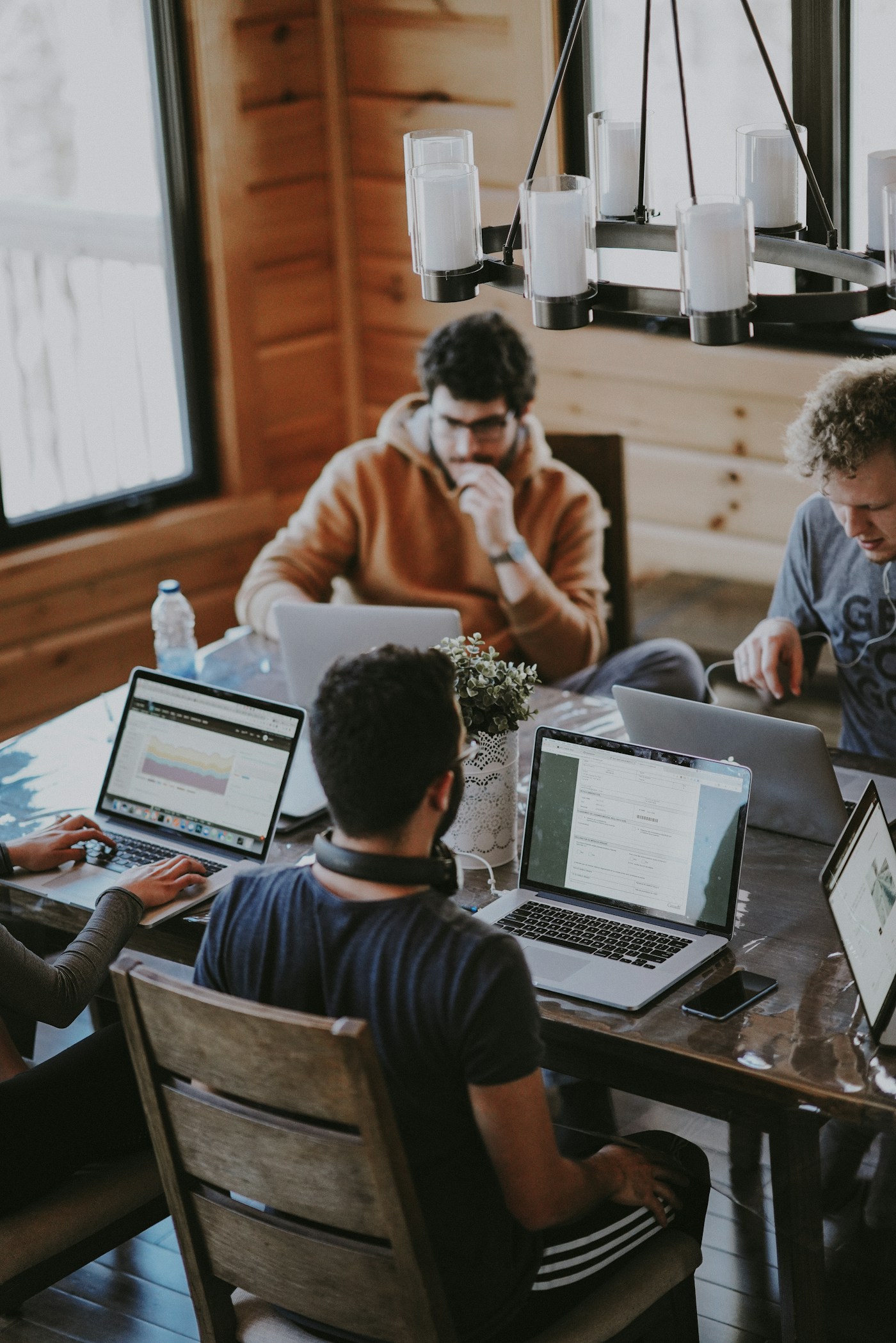A business team coordinating commercial activity around a table